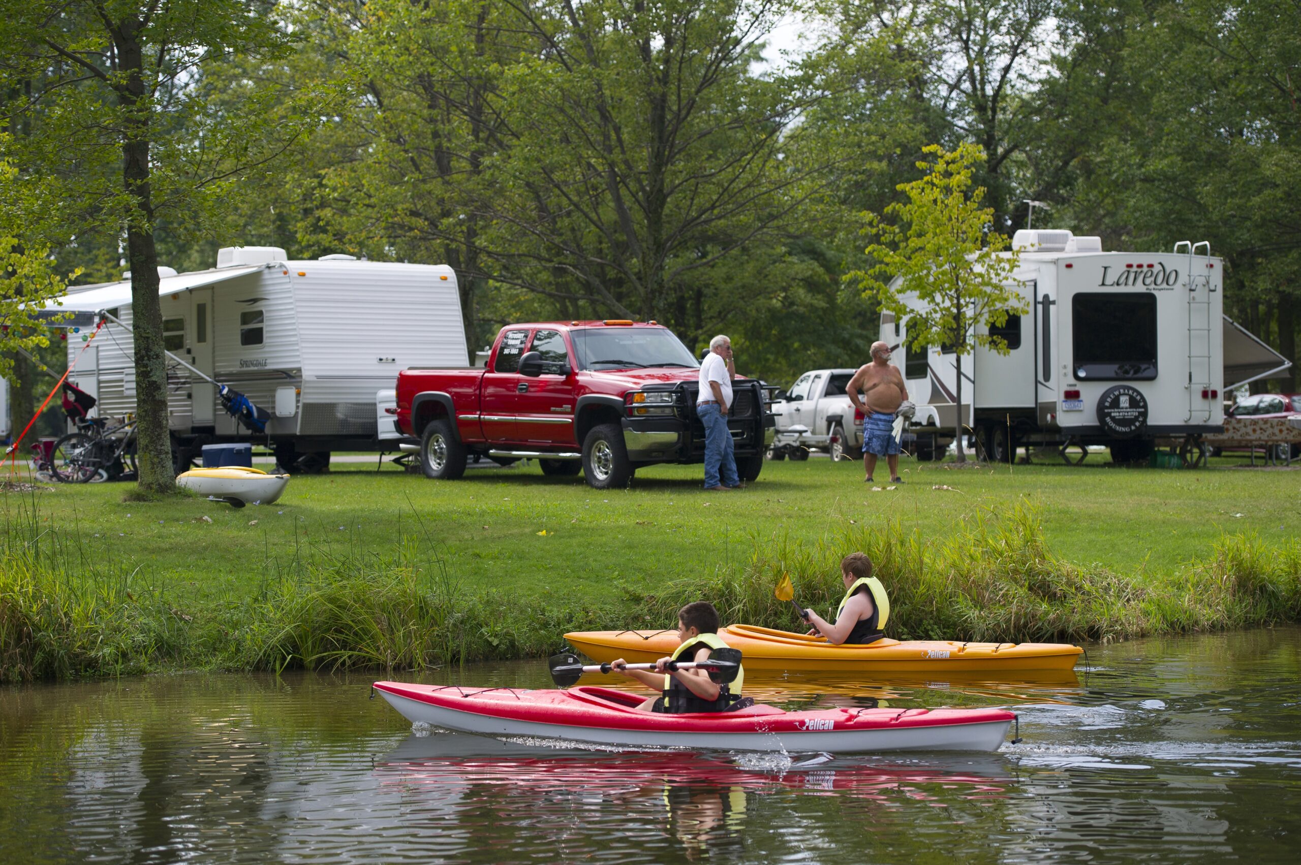campground with RV and kayakers