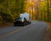 SUV towing an RV in the fall